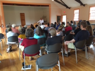 Nancy Aronie speaking to a full house at the Old Town Hall in Aquinnah.